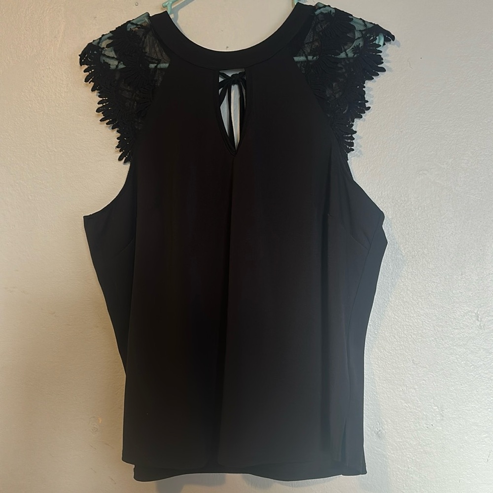 Black blouse with short laced sleeves open back bow tie